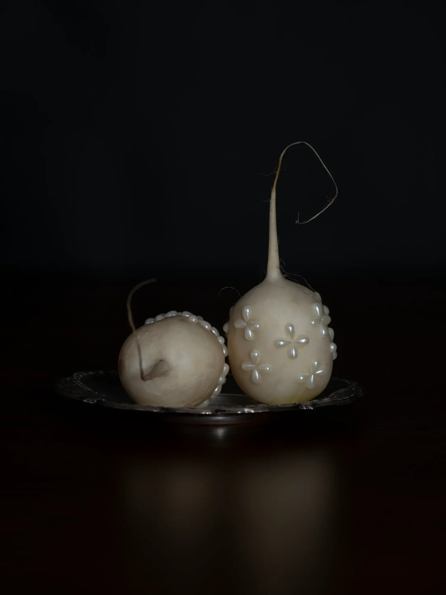 Pearl-studded quince pair on silver tray